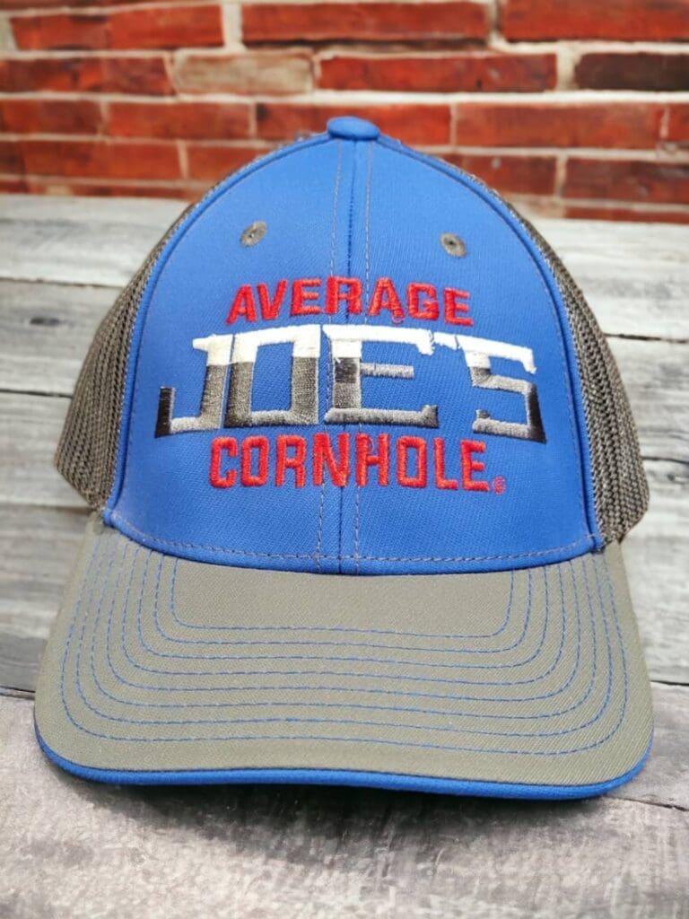 Blue and gray trucker hat with "Average 100% Desirable" text.